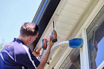 Installing permanent outdoor lighting by Bright Brothers of Space City