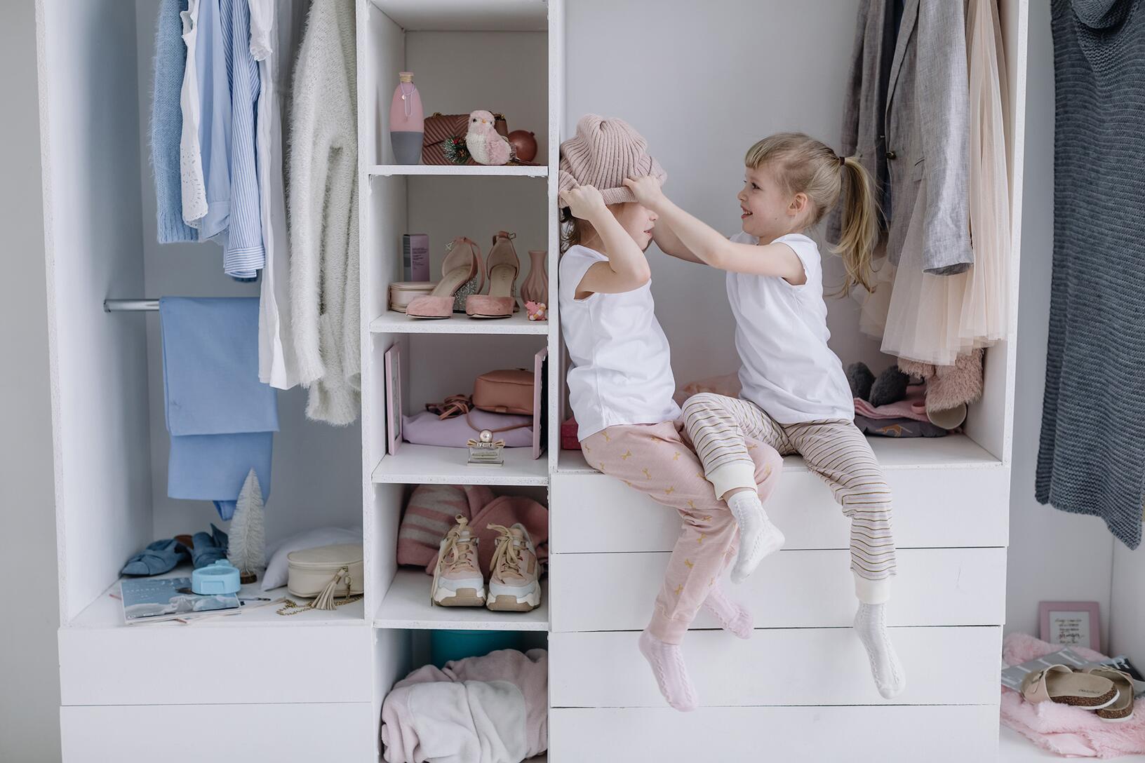 Children playing in newly finished closet