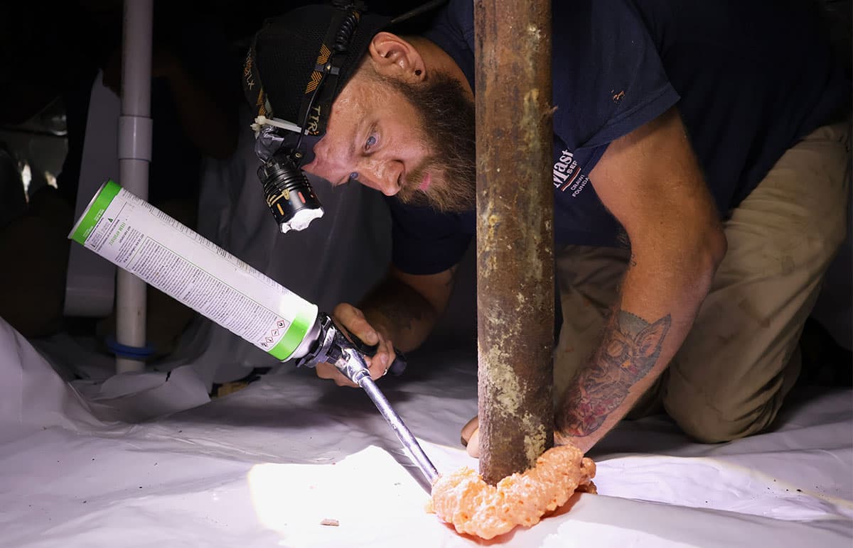 Worker leveling concrete