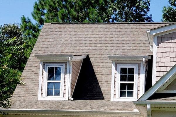 This home's bright, light aesthetic was visibly diminished by the dark dingy roof. Algae naturally builds up on roofs and is hard to avoid, but easy for us to fix! Powerwashing the dark algae off this roof's shingles brought new life to the home's exterior. 
                    