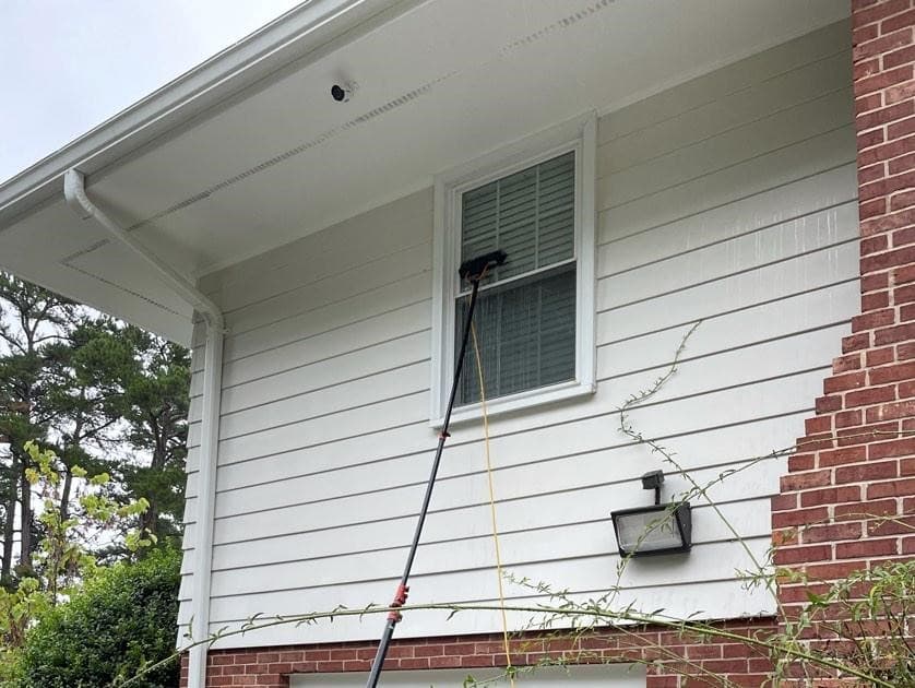 One of our experts completing a window cleaning in Pearland