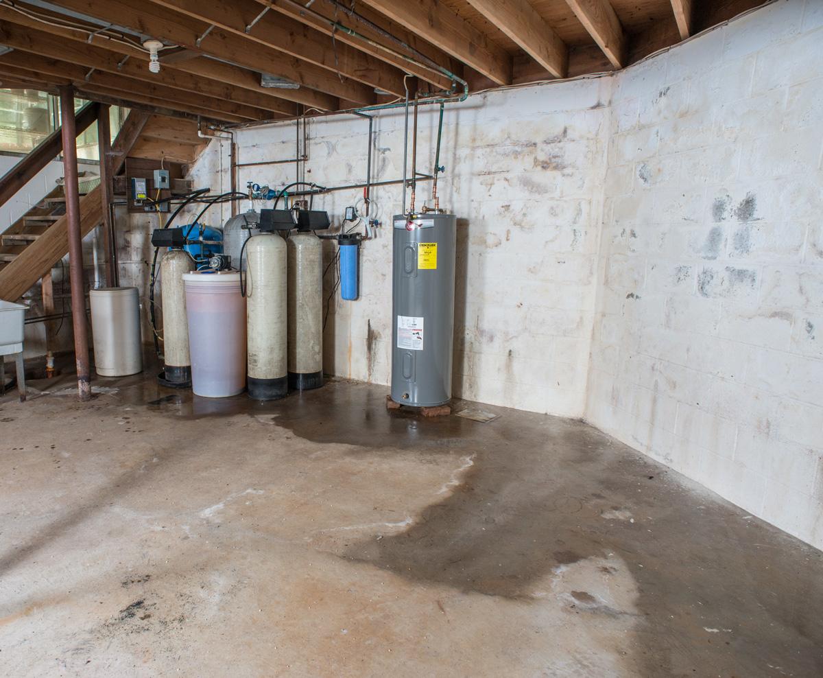 Leaking foundation wall causes flooded basement and other problems.