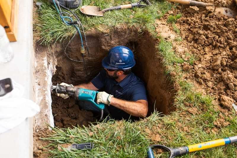 Installation of foundation pier system by Thrasher Foundation Repair