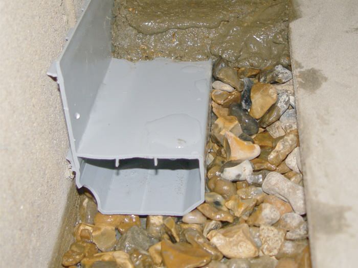 A no-clog basement french drain system installed in Grand Island