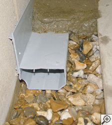 A no-clog basement french drain system installed in Uniontown, OH