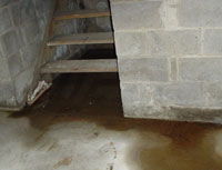 Water Pouring into a Island Lake Basement through Hatchway Doors