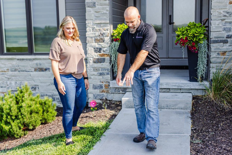 Homeowners with Thrasher technician