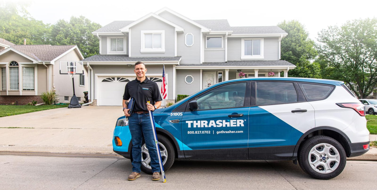 Thrasher representative with vehicle