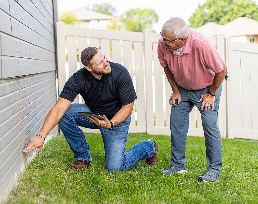 Homeowners with Thrasher technician