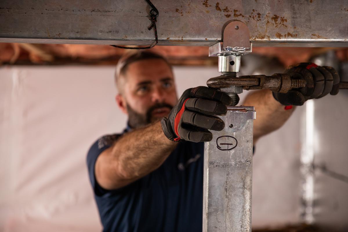 Foundation repair specialists at work