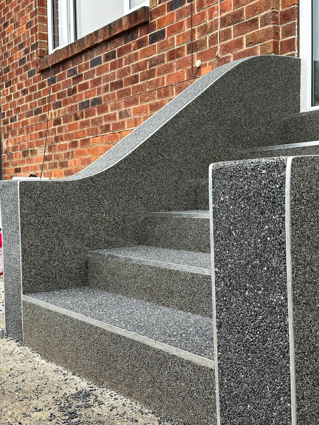 Decorative stone border detail on a resin bound surface