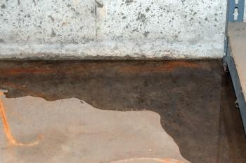 Water seepage where the basement wall meets the concrete floor