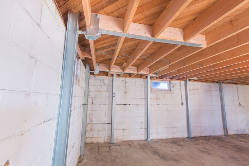 Foundation wall repair with PowerBrace wall stabilization