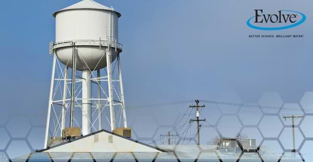 Water tower in a city neighborhood