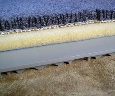 Basement subfloor matting under carpet