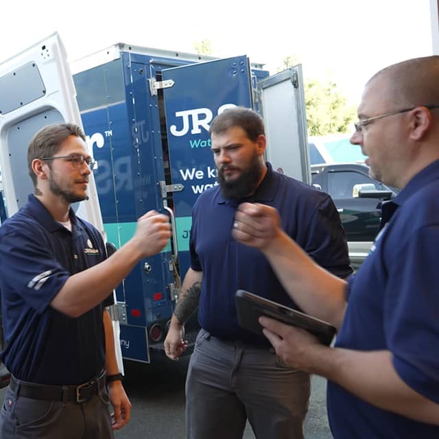 Our team standing by a service van