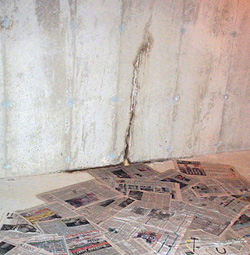 Water leaking from a crack in a foundation wall in Quincy, Illinois