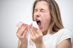 Girl sneezing