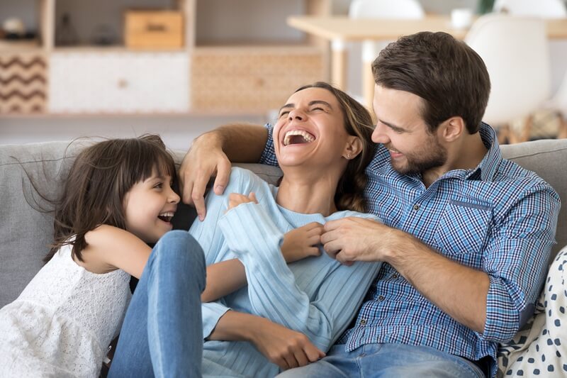 Happy family laughing in healthy home