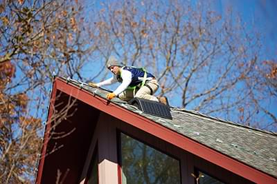 Installing holdiay lighting by Bright Brothers