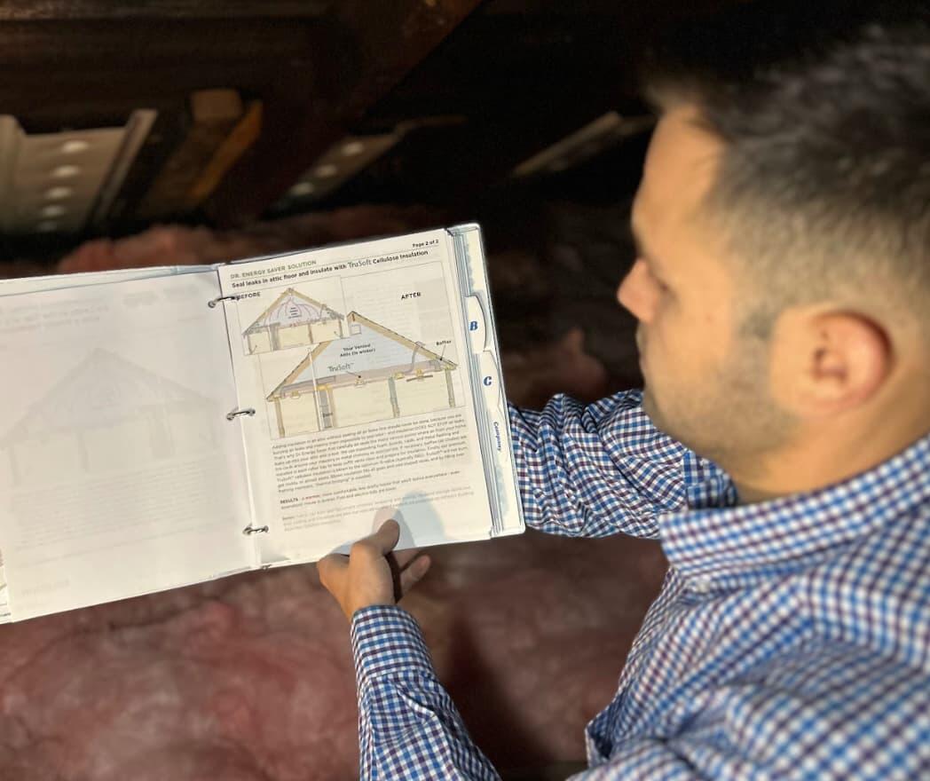 Person showing advantages of home insulation