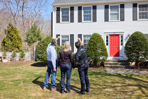 Freedom Roofing inspector reviewing findings with a homeowner
