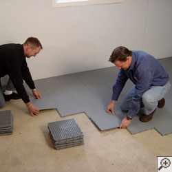 Installation of our waterproof basement floor matting tiles.