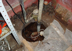 A rusted, failed sump pump system in need of replacement.