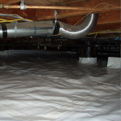 A sealed crawl space with a plastic vapor barrier system installed