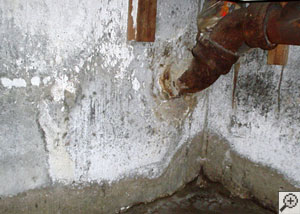 Water droplets forming on an air vent in a basement.