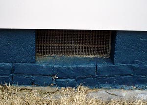 A wide open crawl space vent with a mesh wire screen