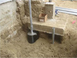 Advancing helical piers adjacent to existing column footings