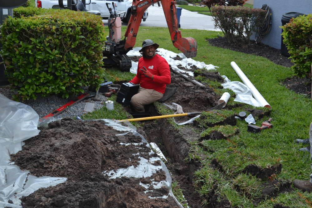 Crew installing French drain