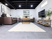 Tiled and carpeted basement flooring options for basement floor finishing in Norwalk