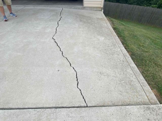 Settled driveway slab at the garage entrance in Greater Chicago & Northwest Indiana