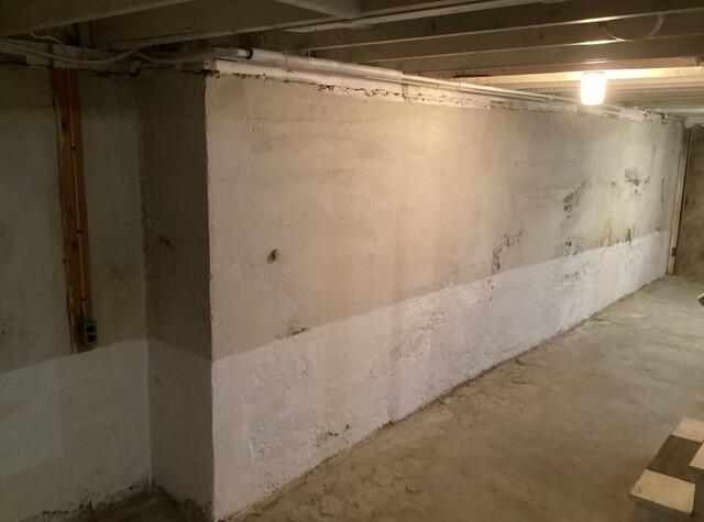 Installing a Sump Pump and Drainage Matting in Troy, NY - Before Photo