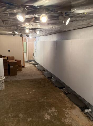 Basement Waterproofing and Flooring Installation in Rensselaer, NY - Before Photo