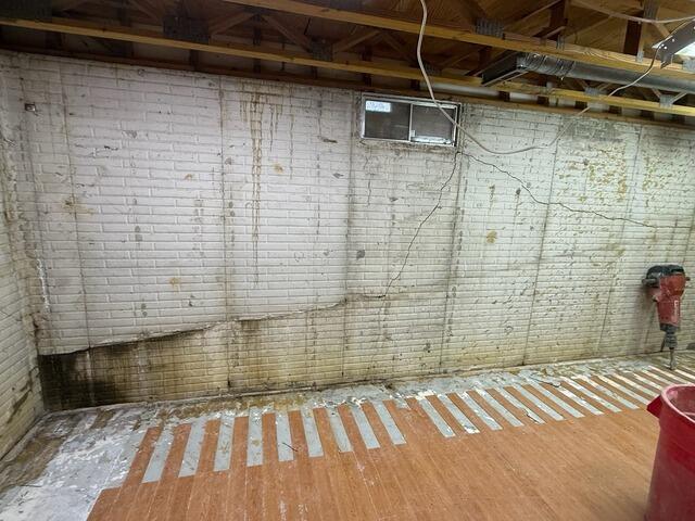 Major Basement Finishing with Waterproofing and Wall Support in Cedar Falls, IA - Before Photo