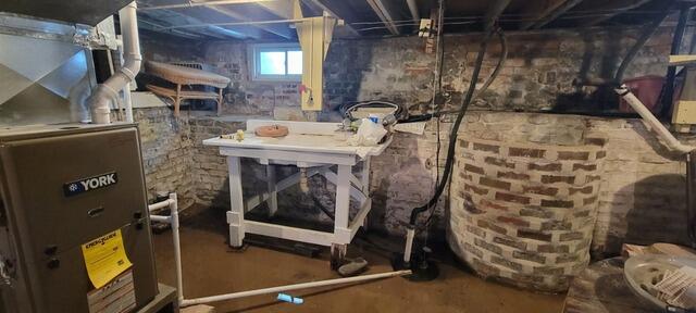 Securing and Waterproofing a Heavy Moisture Basement in Kewanee, IL - Before Photo