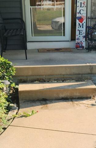 Patio Trip Hazard Elimination and Concrete Leveling in Marion, IA - Before Photo
