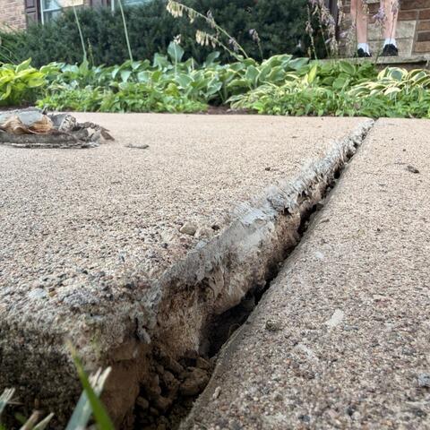 Defying Gravity in Bettendorf: Precision Concrete Realignment Saves Walkway - Before Photo