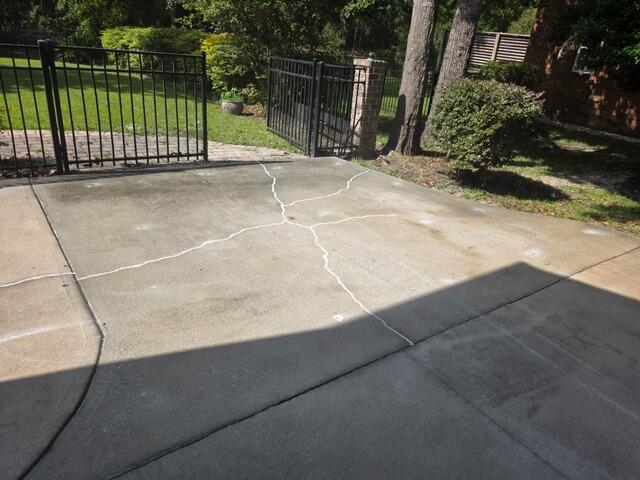 Sealing Cracked and Uneven Concrete Driveway in Richmond Hill, GA - After Photo