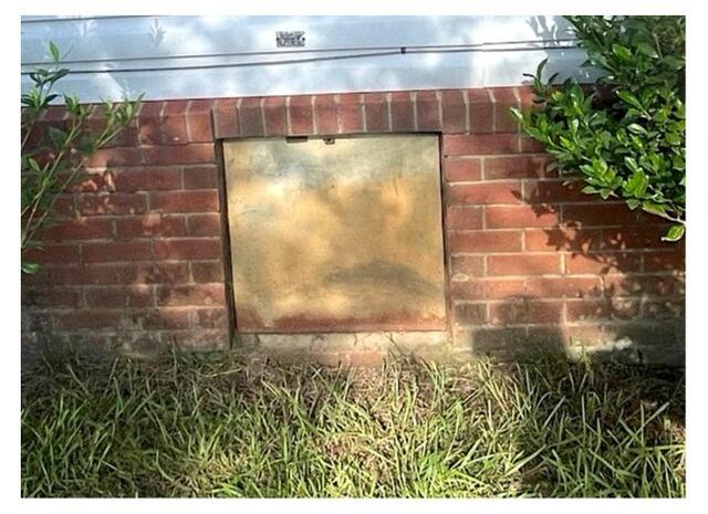 Replacing Rusted Crawl Space Door in Kathleen, GA - Before Photo
