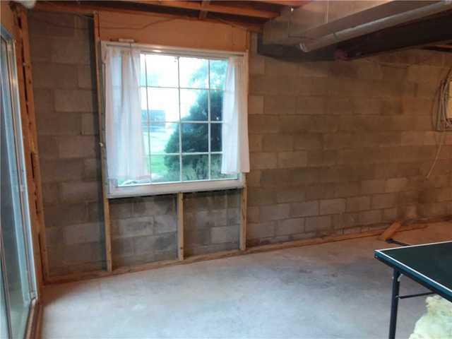 SuperSump with UltraSump Battery Backup Installed in Walkout Basement in West Grove, PA - Before Photo