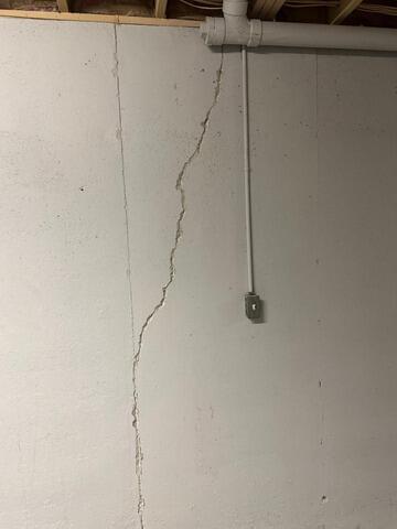 Resolving Basement Wall Moisture Seepage In North East, MD - Before Photo