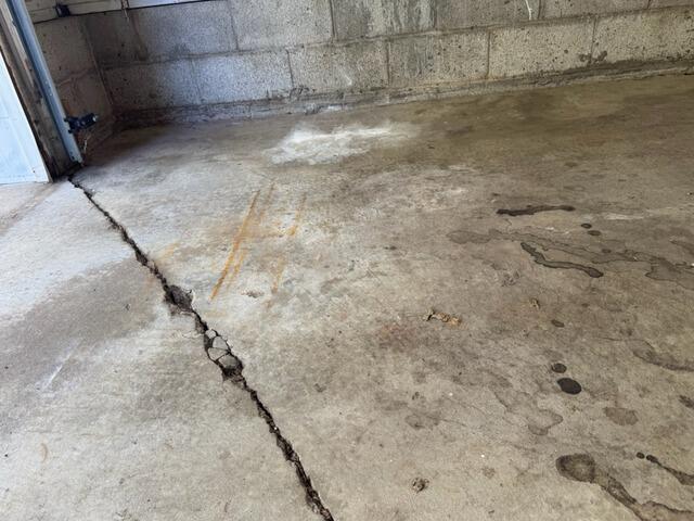 Fixing Concrete Settlement In Phoenix, MD Garage - Before Photo