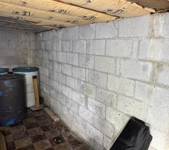 Stabilizing Bowing Walls In Oak Ridge, NJ Basement - Before Photo