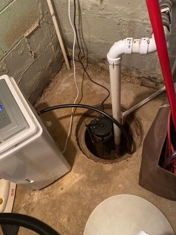 Implementing Drainage Support In Claymont, DE Basement - Before Photo