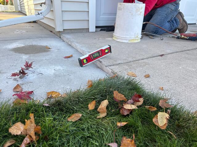 Concrete Lifting & Driveway Repair - Sidewalk Leveling with PolyLevel® & NexusPro® in Appleton, WI - Before Photo