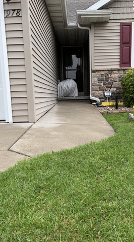 Concrete Driveway and Walkway Repaired with PolyLevel Foam in Neenah, WI - Before Photo